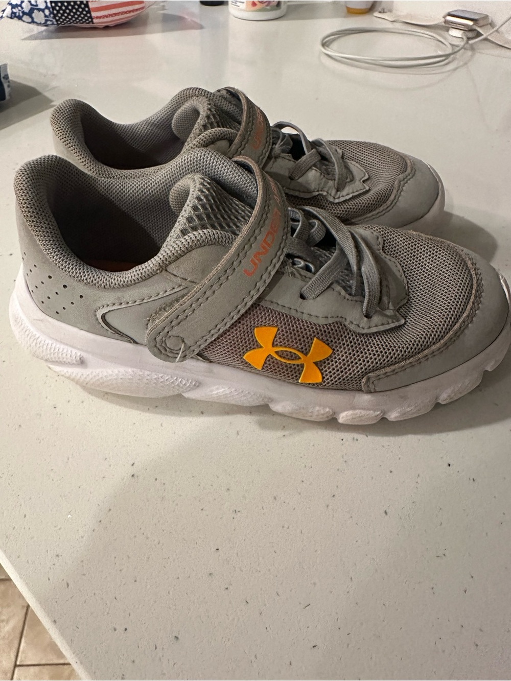 Under Armour Kids Gray Sneakers with orange Logo